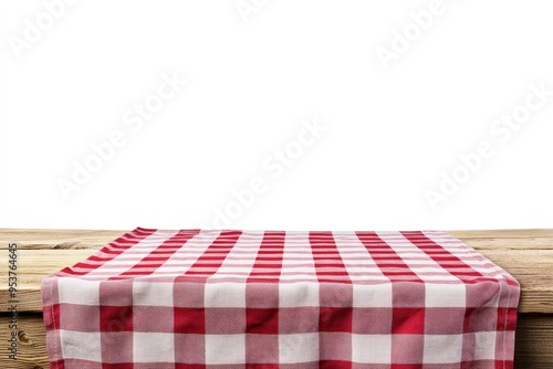 A wooden table with a red and white checkered cloth draped over it, isolated on a white background.