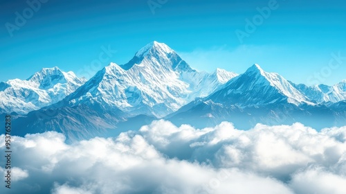 A breathtaking view of the snow-capped peaks of the Himalayas under a clear blue sky, with rolling clouds below.