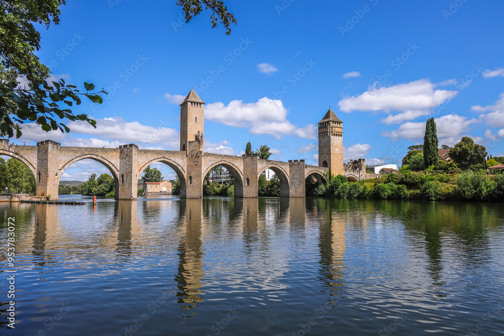 Fototapeta premium Valentré Bridge is a 14th-century six-span fortified stone arch bridge crossing the river Lot to the west of Cahors, in France. It has become a symbol of the city.