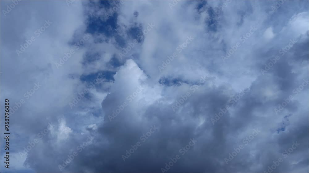 Cloudy cumulonimbus clouds moving away and dark clouds approaching Cloudy cumulonimbus clouds moving away and dark clouds approaching