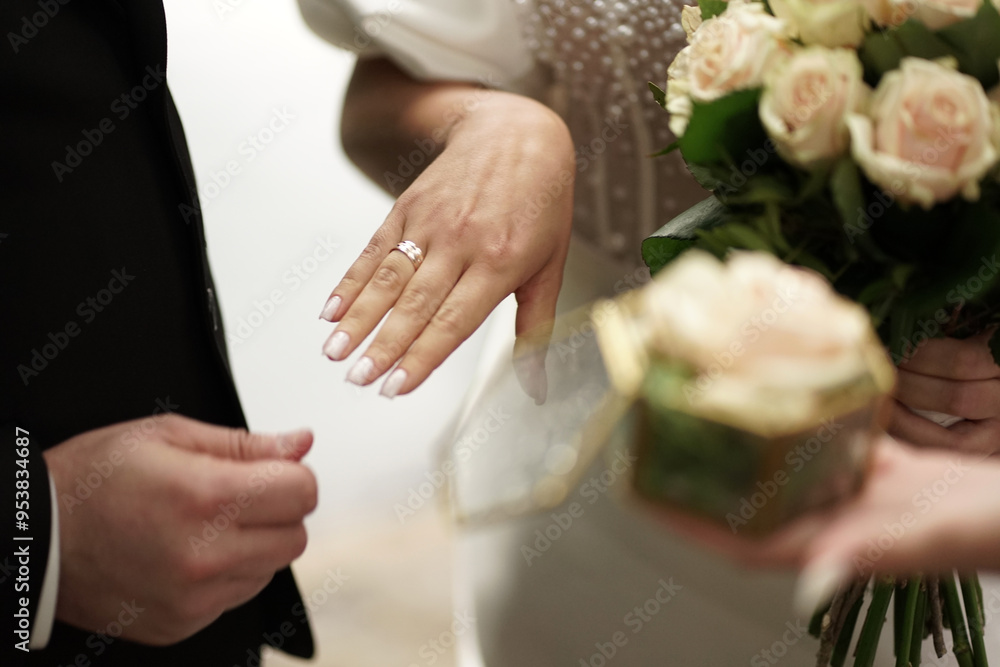 The groom put a wedding ring on the finger of the bride. Wedding ceremony. The groom put a wedding ring on the finger of the bride. Wedding ceremony.
