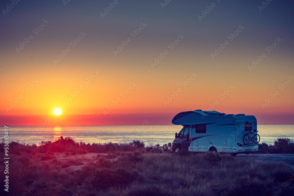 Fototapeta premium Caravan on sea at sunrise.