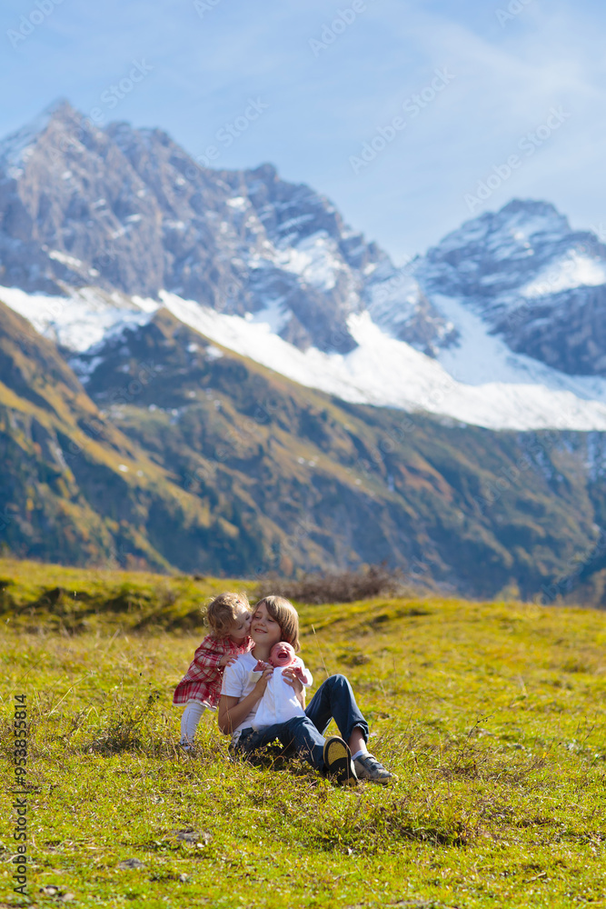 Fototapeta premium Family with kids hiking in the mountains