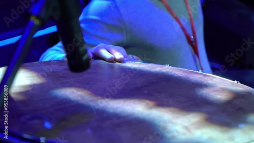 A man playing an instrument on stage