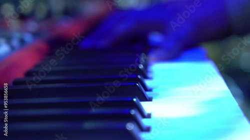 A man plays the piano keys