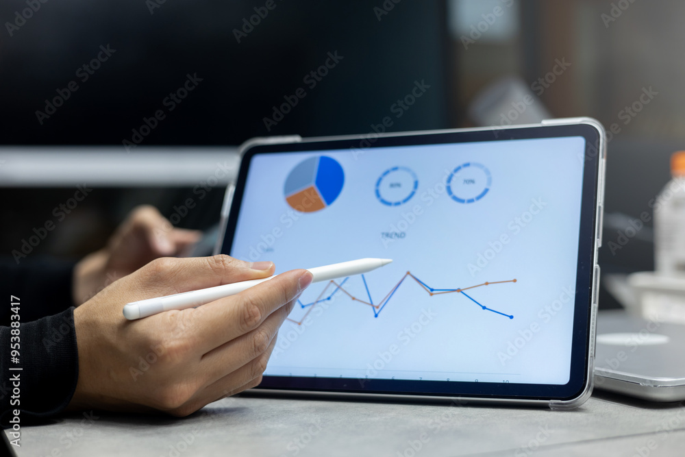 close up manager of marketing department use stylus pen to write or check summary profit report and performance of company on tablet in meeting office room for finance and roi of business concept close up manager of marketing department use stylus pen to write or check summary profit report and performance of company on tablet in meeting office room for finance and roi of business concept
