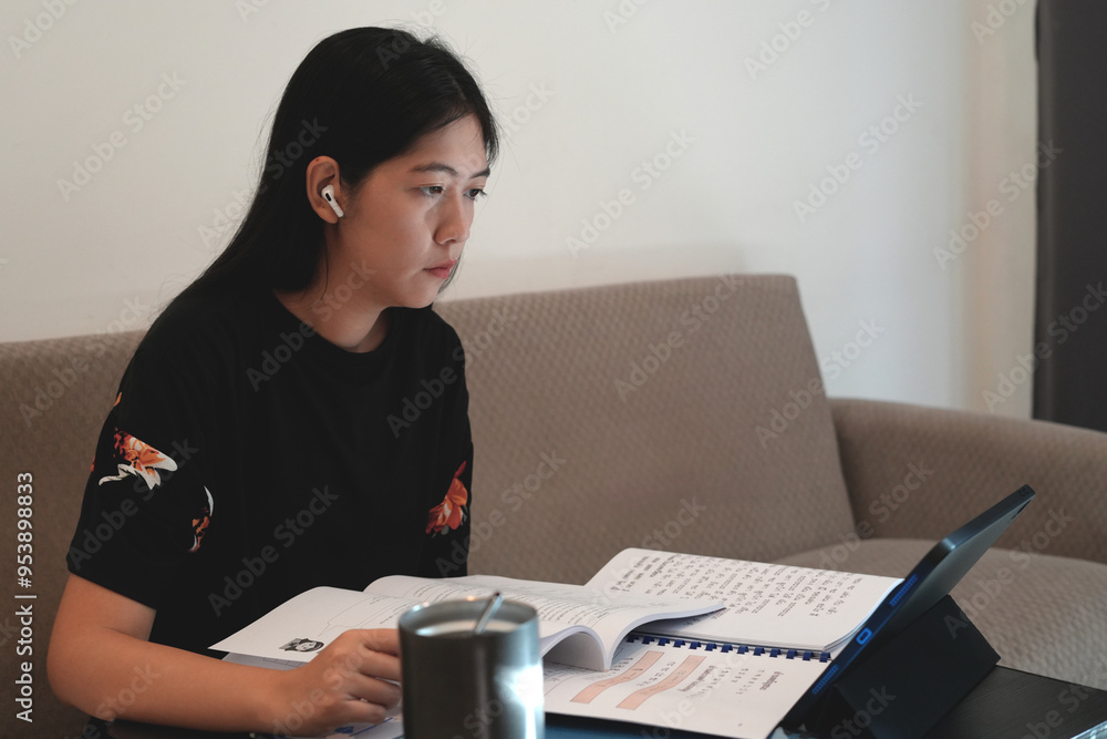 Female young Thai language teacher, college tutor coach looking at webcam and talking with students giving virtual teaching remote class, online lesson by zoom conference call on laptop or tablet. Female young Thai language teacher, college tutor coach looking at webcam and talking with students giving virtual teaching remote class, online lesson by zoom conference call on laptop or tablet.