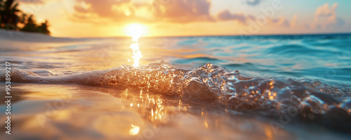 A close-up view of a gentle ocean wave reflecting the golden light of the setting sun.