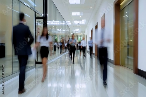 Blurry image. background image of a Group of young People walking quickly in a modern building