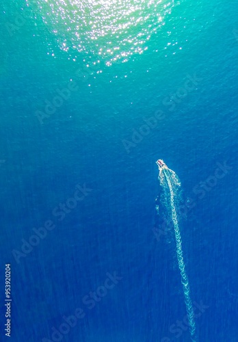 A boat at sea towards the light