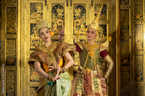 Pantomime (Khon) is traditional Thai classic masked play enacting scenes from the Ramayana with a backdrop of Thai paintings in a public place at Wat Phra Khao, Ayutthaya province, Thailand photo