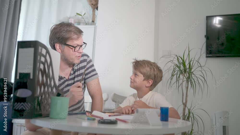 father helps the child to study and do homework for school father helps the child to study and do homework for school