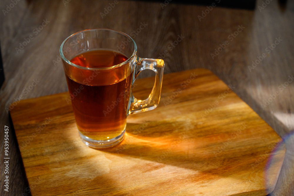 a cup of tea on a table. glass a cup of tea on a table. glass