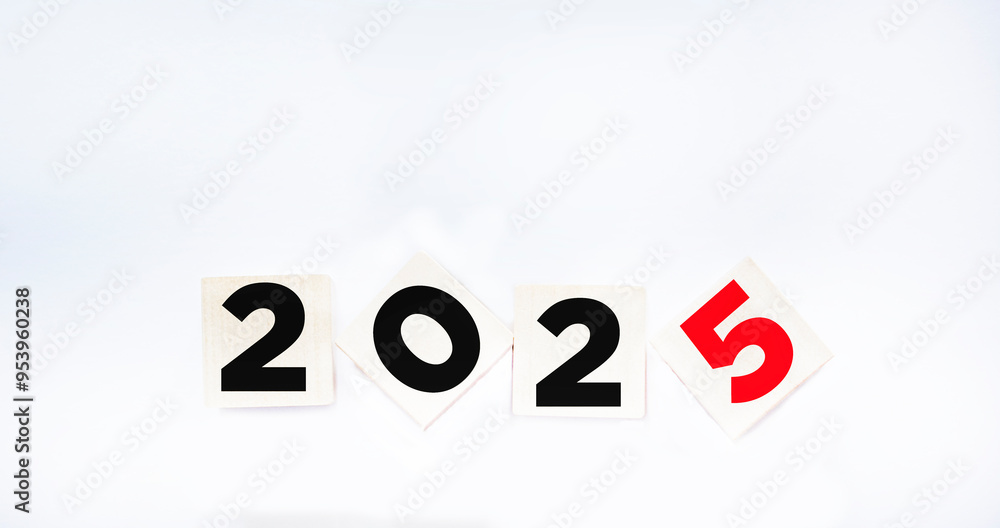 Wooden blocks with the inscription 2025 on a white background. New Year concept Wooden blocks with the inscription 2025 on a white background. New Year concept