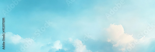 Soft white clouds drift across a light blue sky