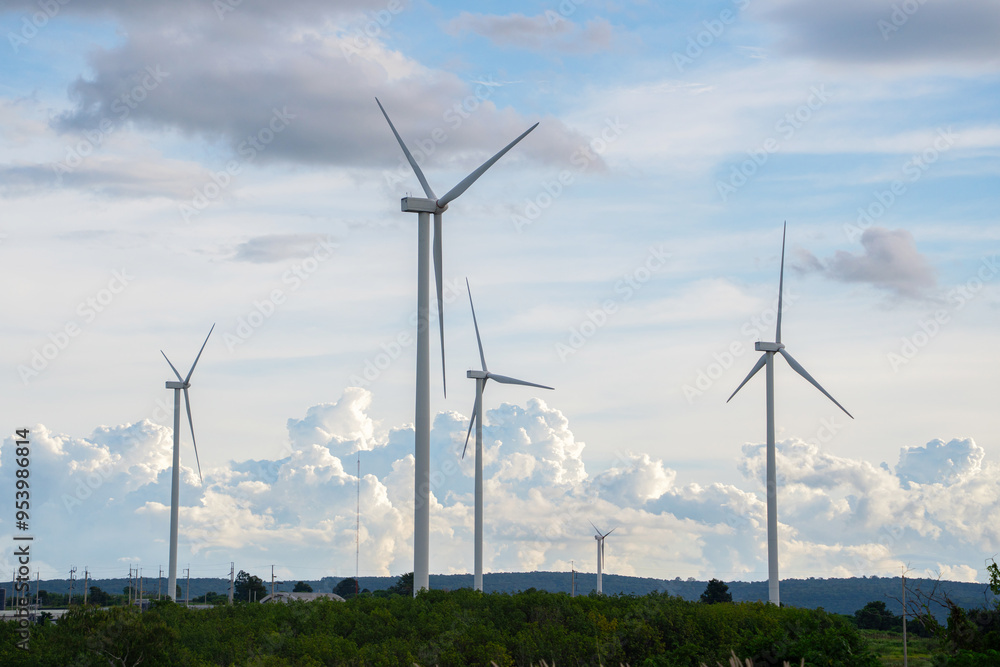Wind turbines stand tall against a backdrop of cloudy skies, scattered across the expansive field. renewable energy. Wind turbines stand tall against a backdrop of cloudy skies, scattered across the expansive field. renewable energy.