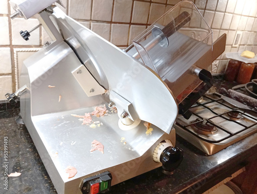 Dirty ham slicer in the kitchen