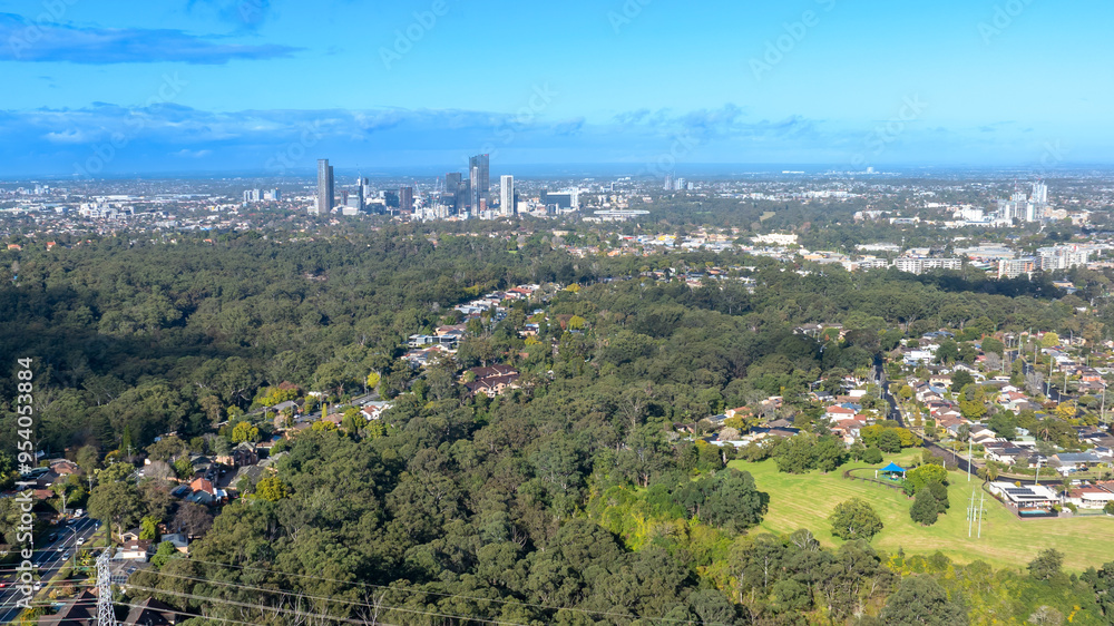 Drone aerial photograph of houses and the general landscape and precinct heading towards to the city of Parramatta in the greater Sydney region of New South Wales in Australia. Drone aerial photograph of houses and the general landscape and precinct heading towards to the city of Parramatta in the greater Sydney region of New South Wales in Australia.