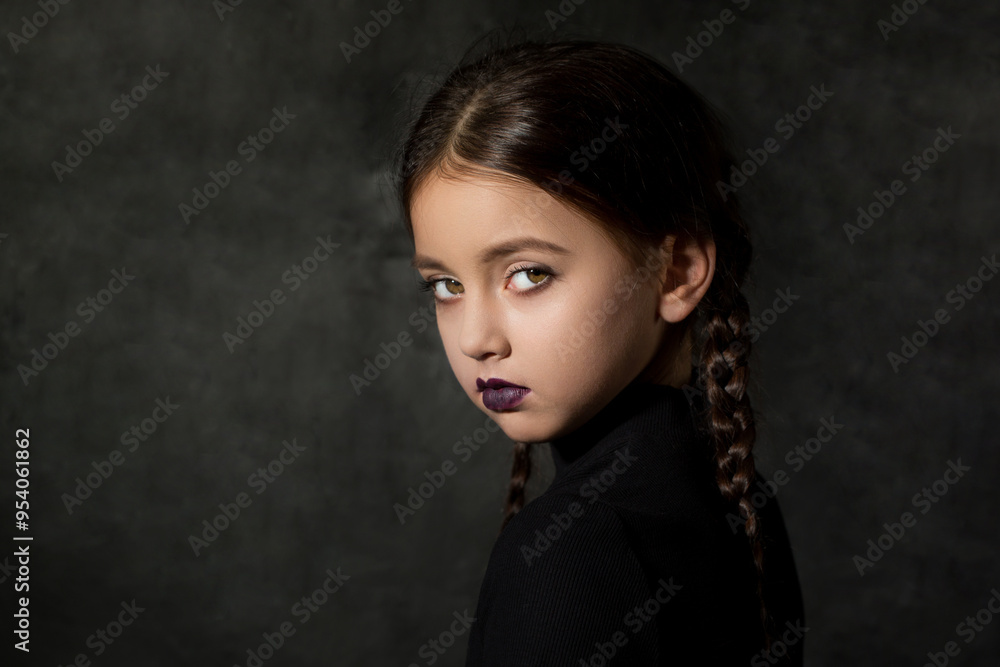 A creepy girl with a piercing dangerous look with braided braids in a black dress