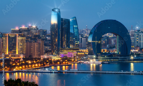 Baku, Azerbaijan. View of the Crescent Bay business center and Port of Baku from the upland park. Evening Baku Boulevard. photo