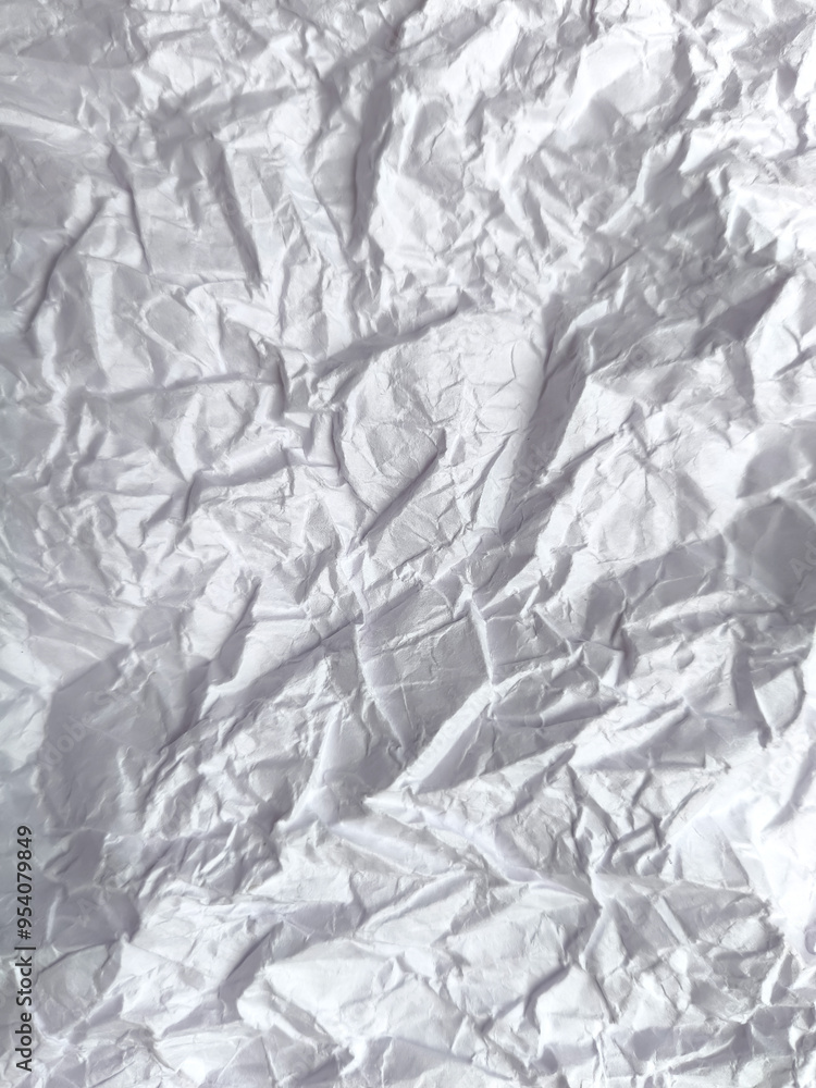 Texture of a white crumpled sheet of paper as a background Texture of a white crumpled sheet of paper as a background