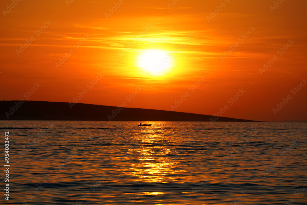 Fiery sunset during summer on the Croatian coast in Dalmatia Fiery sunset during summer on the Croatian coast in Dalmatia