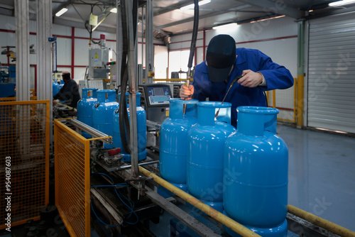 Bottled Gas. Gas cylinder production process. Process of quality control, gas cylinder painting,  high heat test.