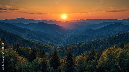  The sun is setting over the mountains with trees in the foreground and a forest in the background