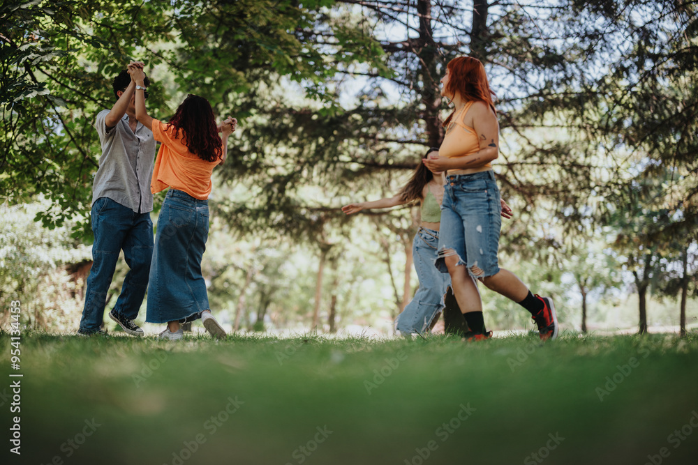 Fototapeta premium Young teenagers having fun in the park, showcasing friendship, joy, and moments of laughter and happiness.