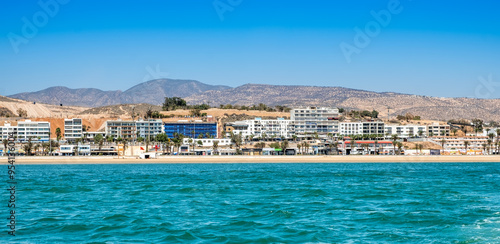 Seaside view of Agadir in Morocco. Popular tourist resort with bay, beach, promenade and hotels on coast of Atlantic ocean near Atlas Mountains in West Africa