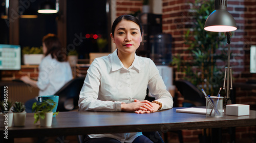 POV of asian human resources employee conducting interview with candidate during videocall in office. Portrait of HR worker using online videoconference app to speak with prospect