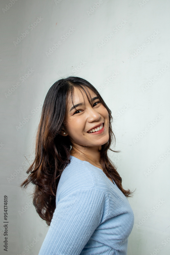 closeup beauty natural woman face with stylish long hair big smile, fashion blue casual crop top standing on white background closeup beauty natural woman face with stylish long hair big smile, fashion blue casual crop top standing on white background