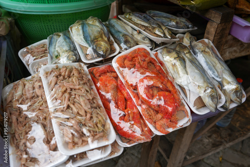 Smoked and salted fish sold at the traditional fish market. Smoking and salting are natural preservation methods without chemicals. Tuban, East Java, Indonesia.  photo