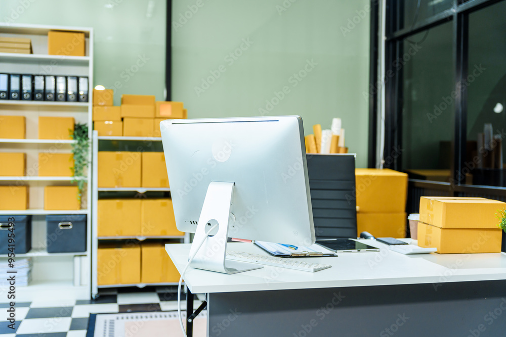 desk with a cardboard box sits alone in office, reflecting a quiet moment in retail and distribution. The space is ready for delivering packages and handling merchandise without any people present. desk with a cardboard box sits alone in office, reflecting a quiet moment in retail and distribution. The space is ready for delivering packages and handling merchandise without any people present.