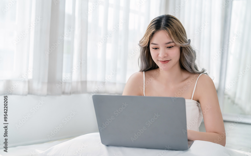 Portrait of beautiful asian woman work from home at online computer desktop in bed. Beauty Asia freelancer girl using laptop in bed room. Small business sme digital network, technology. Portrait of beautiful asian woman work from home at online computer desktop in bed. Beauty Asia freelancer girl using laptop in bed room. Small business sme digital network, technology.