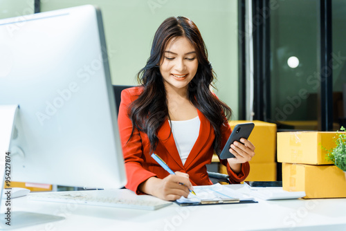 successful Asian businesswoman happily celebrates her achievements during Pride Month, overcoming office syndrome and receiving congratulations for thriving LGBTQ-owned shipping and retail business.