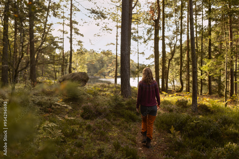 Woman walking in the woods Woman walking in the woods