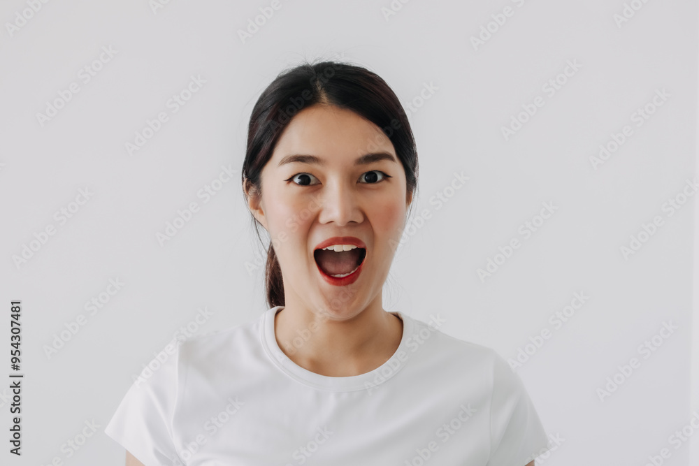 Funny shocked and wow face of asian Thai woman, open wide mouth with big surprised of price and promotion, standing isolated over white background. Funny shocked and wow face of asian Thai woman, open wide mouth with big surprised of price and promotion, standing isolated over white background.