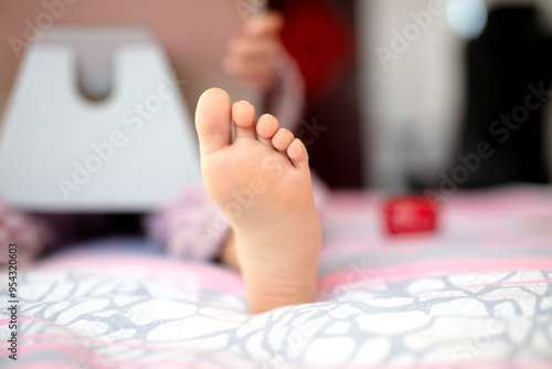 Close-up of a child playing on a tablet