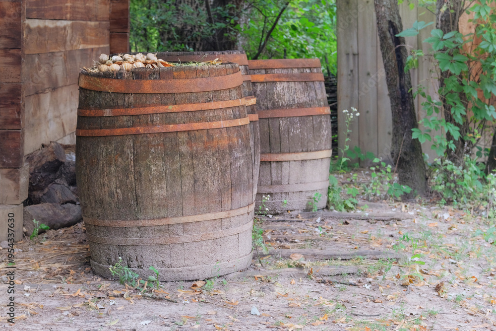 Wooden barrels with metal hoops. Countryside. Wooden barrels with metal hoops. Countryside.