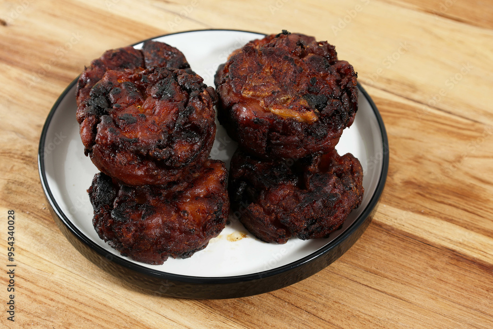 Pisang Goreng Madu or Honey Fried Banana, Made from Banana Ripe Mixed with a Flour and Honey Pisang Goreng Madu or Honey Fried Banana, Made from Banana Ripe Mixed with a Flour and Honey