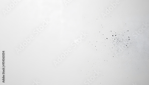 A mostly blank background with a small, centered design, like a tiny star or dot, emphasizing simplicity and space