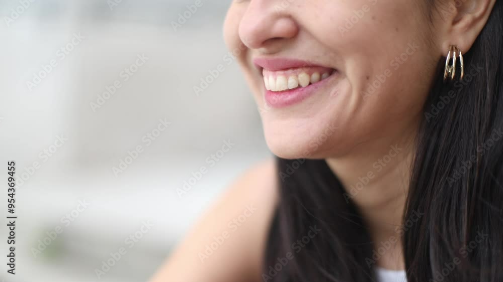 Close-up of a Caucasian woman's face, highlighting her perfect smile. Close-up of a Caucasian woman's face, highlighting her perfect smile.