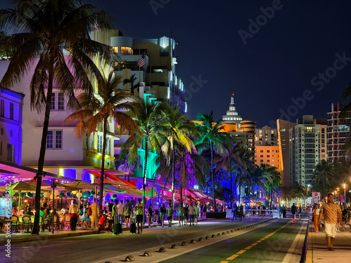 Miami Beach, Florida - Nightlife scene on Ocean Drive in South Beach, filled with al fresco restaurants and art deco buildings. photo