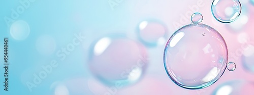  A tight shot of a water droplet against a backdrop of blue and pink Bubbles surface in the foreground