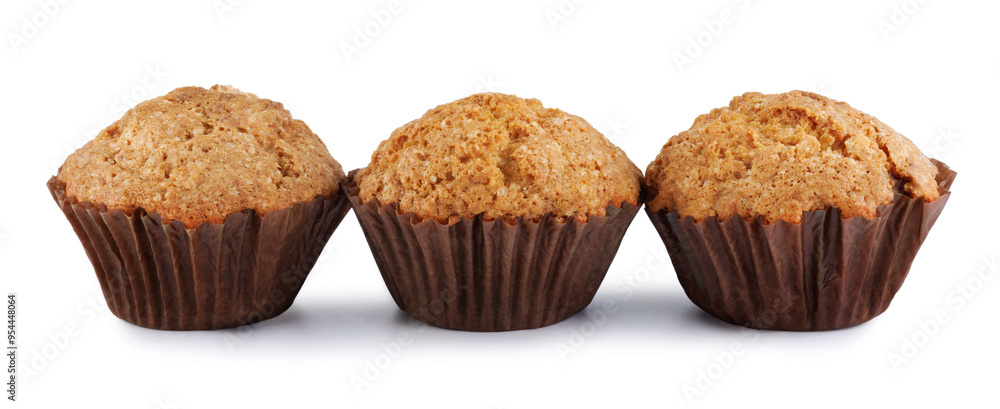 Three muffins isolated on a white background. Three muffins isolated on a white background.