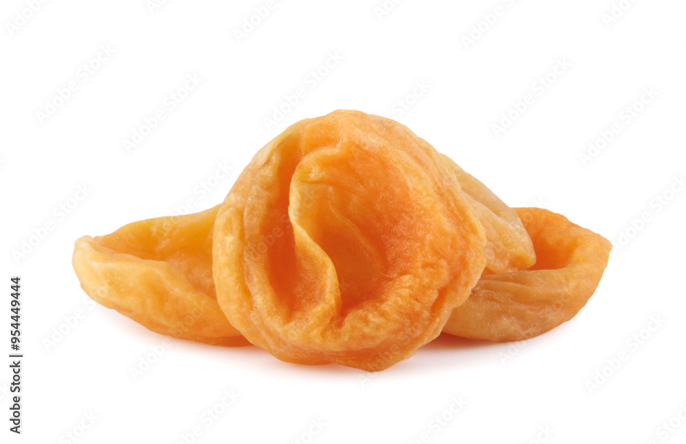 Three dried apricots isolated on a white background. Dried apricots. Three dried apricots isolated on a white background. Dried apricots.