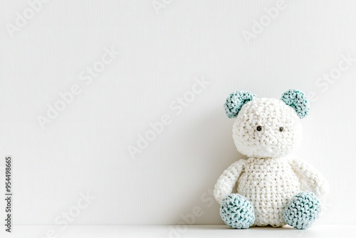 A cute, handmade crochet teddy bear with blue accents, perfect for children's rooms, gifts, or decorative displays.