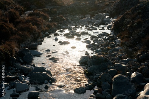 river in the mountains at evening