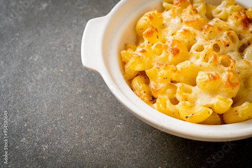 American mac and cheese, macaroni pasta in cheesy sauce photo